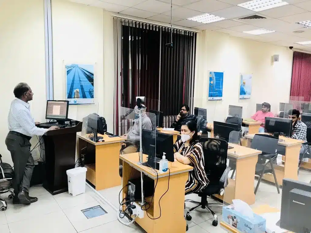 Trainer teaching a class at Green International